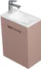 A rose-colored vanity set with a sink and faucet, shown from a diagonal angle against a white background. Voir les images du produit