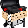 A black charcoal grill with wooden side panels and a wire rack underneath, shown on a white background. Náhľad obrázku produktu