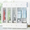 An open modular wardrobe with clothes hanging inside and folded items at the bottom. Anteprima dell’immagine prodotto