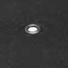 A close-up view of a grommet on a dark gray fabric. Anteprima dell’immagine prodotto