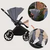 A collage of images showing a stroller from different angles and close-ups of its features, including a child in the stroller and the stroller's footrest. Náhled obrázku produktu