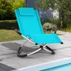 A blue lounge chair sits on a wooden deck next to a pool. Produktbild-Vorschau
