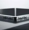 A close-up view of the corner of a stainless steel sink, showing the edge and some small black clips attached to it. Produktbild-Vorschau