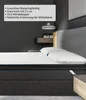 A close-up view of a mattress topper on a bed, with a dark gray wall and a modern bedside table in the background. Produktbild-Vorschau
