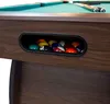A close-up view of a billiard table's side pocket filled with billiard balls. Podgląd zdjęcia produktu