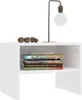 A white nightstand with books and decorative items on top, against a white background. Náhľad obrázku produktu