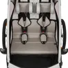 A top-down view of the interior of a child trailer, showing two seats with safety harnesses. Produktbild-Vorschau