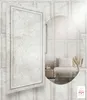 A decorative wall panel with a mirror reflecting a living room scene. Produktbild-Vorschau
