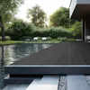 A modern outdoor living space with a swimming pool and a dark gray composite deck. Produktbild-Vorschau