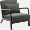 A green armchair with a dark wood frame and a small cushion. Produktbild-Vorschau
