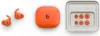 A set of orange Beats by Dr. Dre Powerbeats Fit wireless earbuds with their charging case and extra ear tips, laid out on a white background. Produktbild-Vorschau