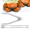 Cooked crabs and seafood tools on a white background. Podgląd zdjęcia produktu