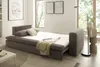 A sofa bed is set up in a living room with a window in the background. Produktbild-Vorschau