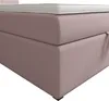 Close-up of a pink upholstered bed base with a white mattress topper. Voir les images du produit