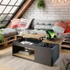 A modern living room with a couch, coffee table, and large window. Voir les images du produit