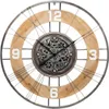 A close-up studio shot of a decorative wall clock with a mechanical gear design. Náhľad obrázku produktu