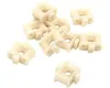 A pile of small, cream-colored plastic plant holders on a white background. Náhled obrázku produktu