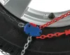 A close-up of a snow chain attached to a car tire and wheel. Produktbild-Vorschau