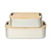 Two stacked aluminum lunch boxes with wooden lids. Anteprima dell’immagine prodotto