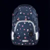 A navy blue backpack with a polka dot pattern is shown against a black background. Voir les images du produit