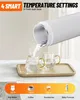 Water being poured from a white electric kettle into two clear glass cups on a wooden tray. A temperature setting graphic is at the bottom. Produktbild-Vorschau