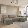 A modern living room with a large sectional sofa.