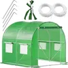 A green greenhouse with a white frame and accessories laid out around it. Produktbild-Vorschau