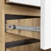 Close-up view of drawer slides and wooden drawer fronts of a cabinet. Produktbild-Vorschau