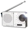 A silver emergency radio with an extended antenna and a flashlight emitting light. Voir les images du produit