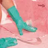 A person wearing teal gloves is applying a pink waterproofing membrane to a shower floor. Náhľad obrázku produktu