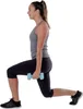 A woman is performing a lunge exercise with a dumbbell. Anteprima dell’immagine prodotto