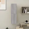 A wall-mounted cabinet is shown on a wall, next to a framed picture and a shelf with books. Produktbild-Vorschau
