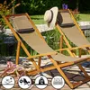 Two wooden deck chairs with beige fabric in a garden setting. Produktbild-Vorschau