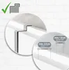 A close-up illustration of a white door hook, with a diagram showing the maximum dimensions it can accommodate for hanging items. The background is a white brick wall. Produktbild-Vorschau