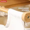 Close-up of a bamboo laundry basket with a white fabric liner. Podgląd zdjęcia produktu