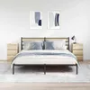 A bedroom scene with a bed, two nightstands, and artwork on the wall. Náhľad obrázku produktu