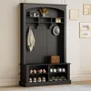 A dark gray hall tree with a bench and shoe storage, set against a light gray and white wall. Anteprima dell’immagine prodotto