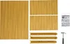 A collection of golden-colored metal pieces arranged to form a rectangular frame, along with a hammer and an instruction manual. Produktbild-Vorschau