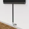 A black cable management channel is attached to a white wall, with cables running through it and plugging into a wall socket. Anteprima dell’immagine prodotto