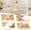 A wooden climbing triangle with a slide and various climbing elements, set up indoors on a carpeted floor. The image is divided into a main view and four close-up detail shots. Produktbild-Vorschau