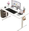 A white adjustable standing desk with a computer setup. Náhled obrázku produktu