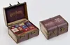 A Harry Potter themed advent calendar shaped like a Hogwarts trunk, with the trunk open showing various items inside and a closed trunk next to it. Produktbild-Vorschau