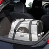 A dog carrier bag is placed in the trunk of a car. Náhled obrázku produktu