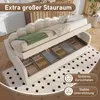 A beige upholstered bed frame with its storage drawers open, revealing neatly organized items. A green blanket is draped over the mattress. Náhled obrázku produktu