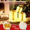 Illuminated Christmas gift boxes and candles are displayed in a festive setting. Podgląd zdjęcia produktu