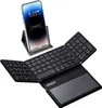A foldable Bluetooth keyboard with a large touchpad and a smartphone stand holding a smartphone. Produktbild-Vorschau