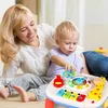 A mother and her baby are playing with a musical toy keyboard. Náhľad obrázku produktu