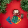 Harry Potter themed items arranged on a red background with Christmas tree branches. Náhled obrázku produktu