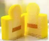 A close-up of a cut dessert with yellow frosting and an orange filling. Podgląd zdjęcia produktu