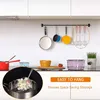 A kitchen scene with various utensils and cookware displayed. Produktbild-Vorschau